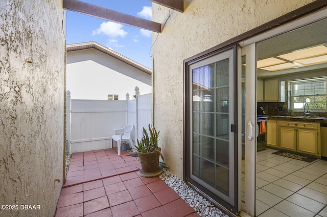 balcony with a sink and a patio