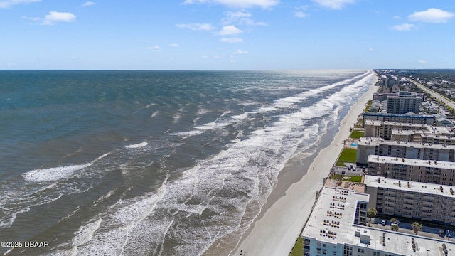 exterior space featuring a city view, a beach view, and a water view