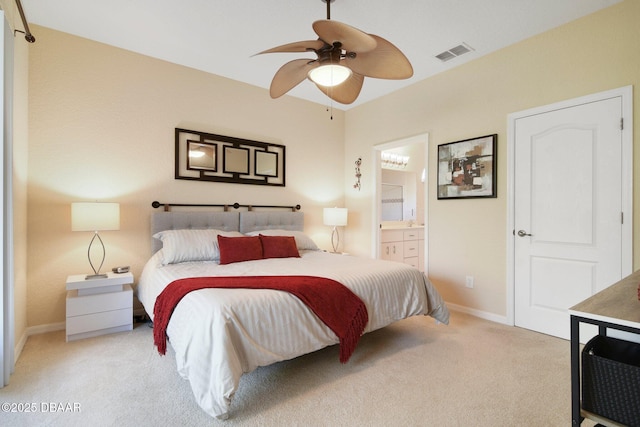 carpeted bedroom with connected bathroom and ceiling fan