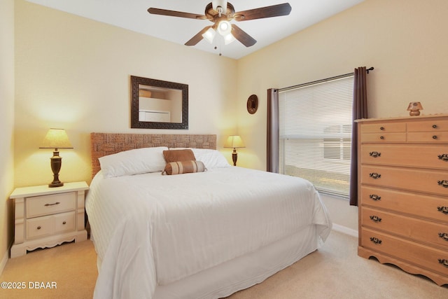 bedroom featuring light colored carpet and ceiling fan