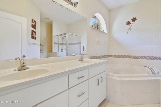 bathroom with vanity, tile patterned floors, and plus walk in shower