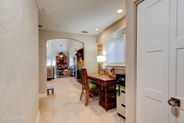 dining space featuring light tile patterned flooring