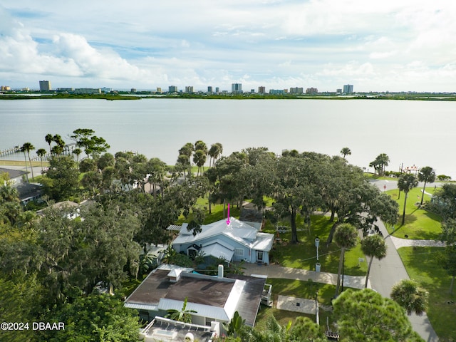 birds eye view of property with a water view