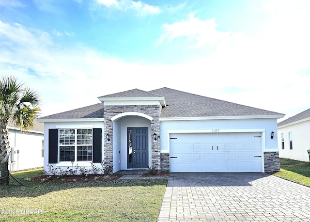 ranch-style house with an attached garage, stone siding, decorative driveway, and a front yard