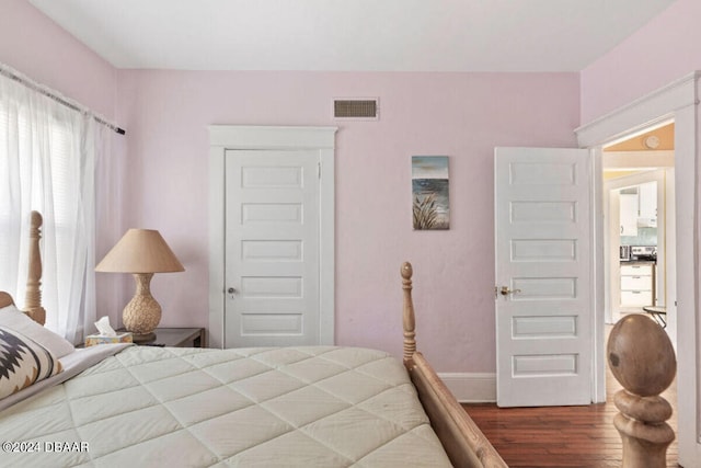 bedroom featuring a closet and wood-type flooring