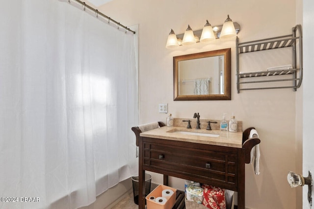 bathroom featuring vanity and shower / bath combination with curtain