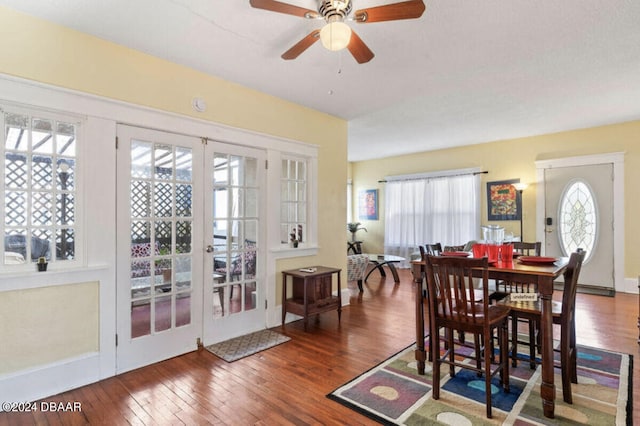 dining area featuring french doors, a wealth of natural light, ceiling fan, and dark hardwood / wood-style flooring