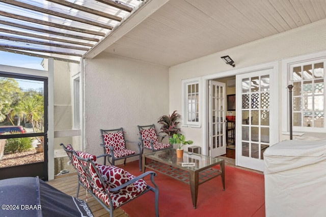 exterior space with french doors and a pergola