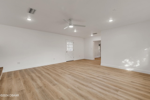 spare room with light hardwood / wood-style floors and ceiling fan