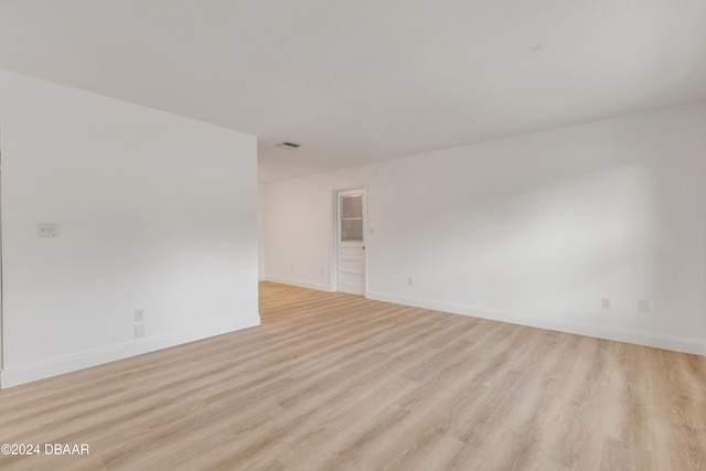 unfurnished room featuring light wood-type flooring