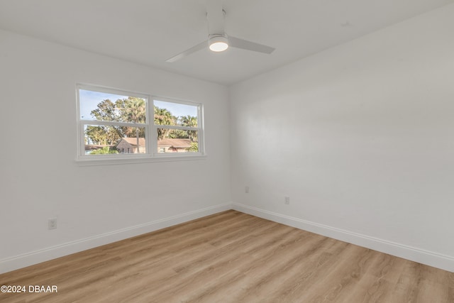 empty room featuring ceiling fan and light wood-type flooring