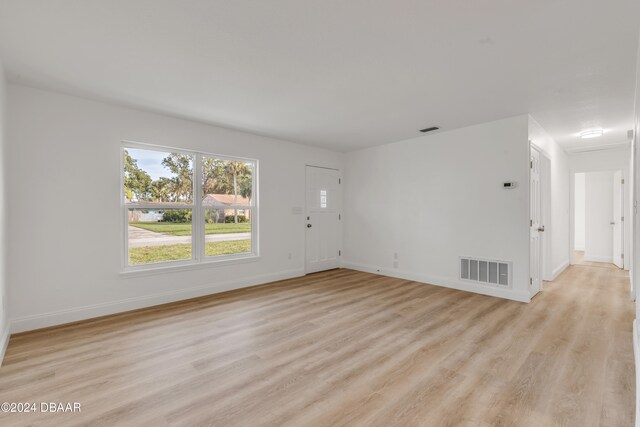 unfurnished living room with light hardwood / wood-style floors