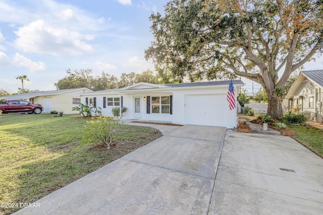 single story home with a garage and a front yard