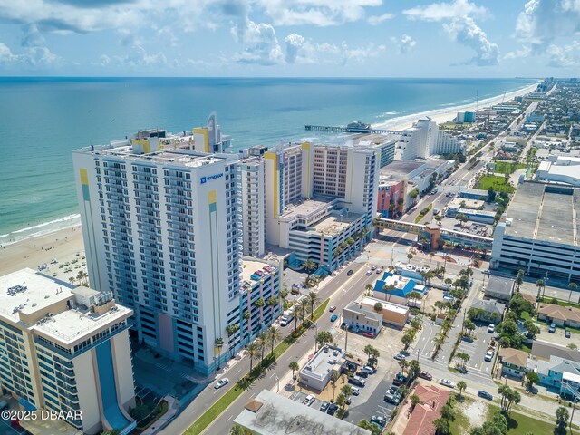 birds eye view of property with a view of city and a water view