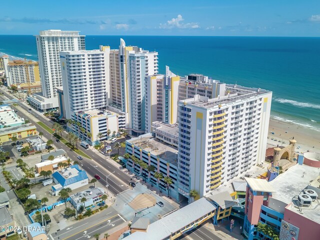 drone / aerial view featuring a water view and a view of city