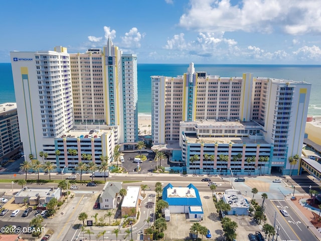 aerial view featuring a view of city and a water view