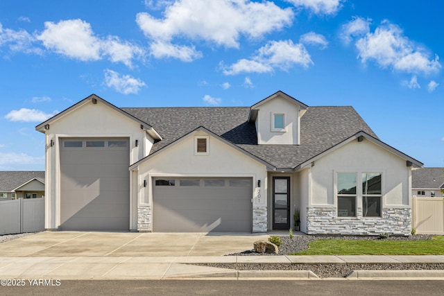 201 E Chinook Rd Lot # 10, Ellensburg, WA 98926 - view of front of property with stucco siding, a garage, roof with shingles, concrete driveway, and stone siding
