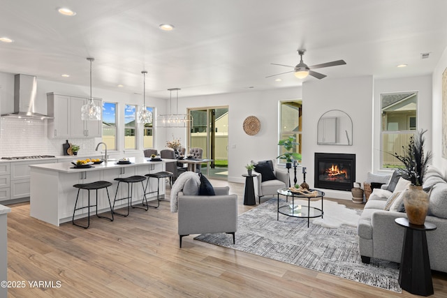 201 E Chinook Rd Lot # 10, Ellensburg, WA 98926 - living room featuring recessed lighting, a ceiling fan, light wood-type flooring, and a glass covered fireplace