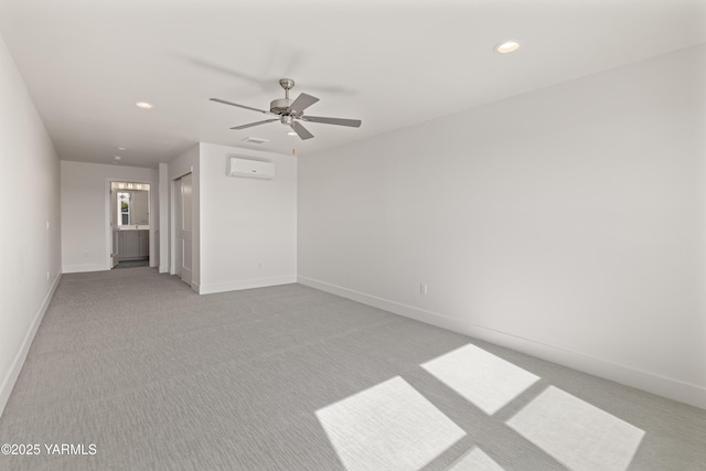 201 E Chinook Rd Lot # 10, Ellensburg, WA 98926 - empty room featuring an AC wall unit, light colored carpet, a ceiling fan, baseboards, and recessed lighting