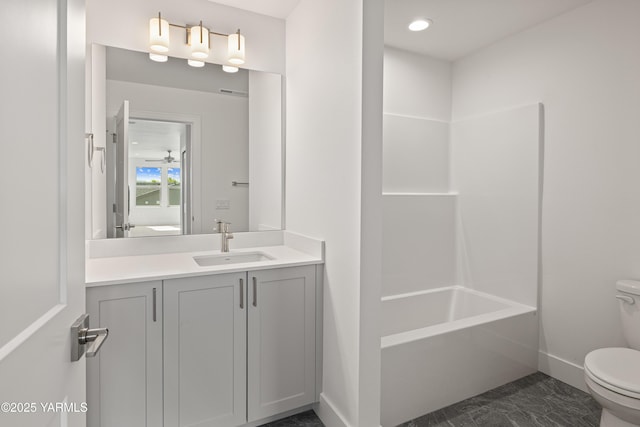201 E Chinook Rd Lot # 10, Ellensburg, WA 98926 - bathroom featuring toilet, vanity, marble look tile flooring, baseboards, and tub / shower combination