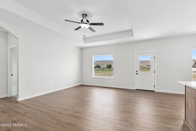 4608 W Larch Ave, Yakima, WA 98908 - unfurnished living room with a raised ceiling, wood finished floors, and healthy amount of natural light