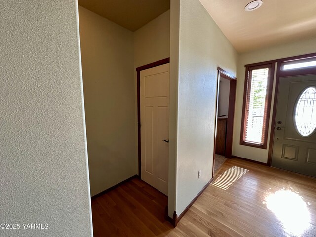 1010 S 89th Ave, Yakima, WA 98908 - entrance foyer with wood finished floors, a textured wall, and baseboards
