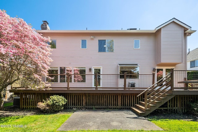 23812 21st Dr Unit Se, Bothell, WA 98021 - back of house featuring a chimney, stairway, and a deck