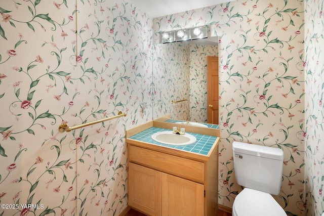 23812 21st Dr Unit Se, Bothell, WA 98021 - half bathroom with vanity, toilet, and wallpapered walls