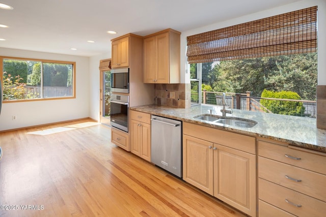 23812 21st Dr Unit Se, Bothell, WA 98021 - kitchen featuring light wood-style floors, a sink, a healthy amount of sunlight, and stainless steel appliances