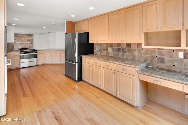 23812 21st Dr Unit Se, Bothell, WA 98021 - kitchen with decorative backsplash, light brown cabinetry, light stone countertops, light wood-style floors, and stainless steel appliances