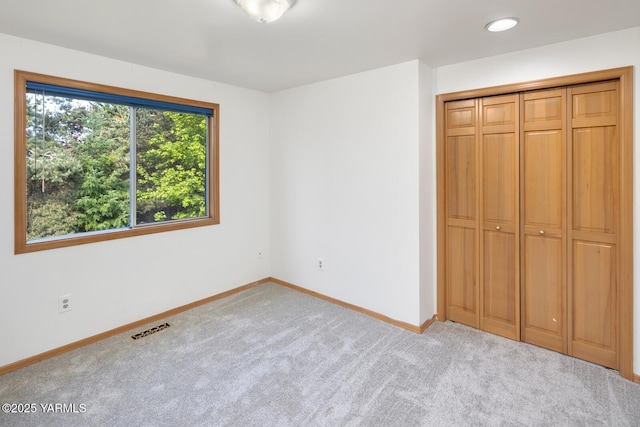 23812 21st Dr Unit Se, Bothell, WA 98021 - unfurnished bedroom with carpet floors, baseboards, visible vents, and a closet