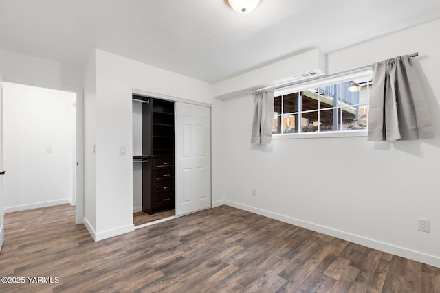 12307 Tieton Dr, Yakima, WA 98908 - unfurnished bedroom with wood finished floors, a closet, and baseboards