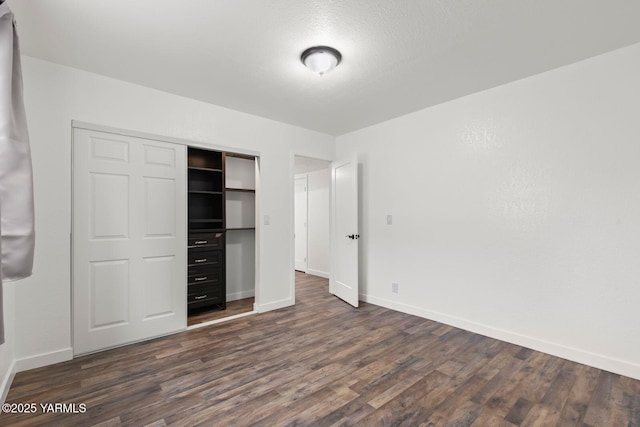 12307 Tieton Dr, Yakima, WA 98908 - unfurnished bedroom featuring dark wood-style flooring and baseboards