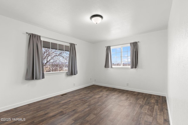 12307 Tieton Dr, Yakima, WA 98908 - unfurnished room featuring dark wood finished floors and baseboards