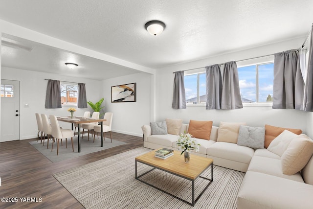 12307 Tieton Dr, Yakima, WA 98908 - living area with wood finished floors, a textured ceiling, and baseboards