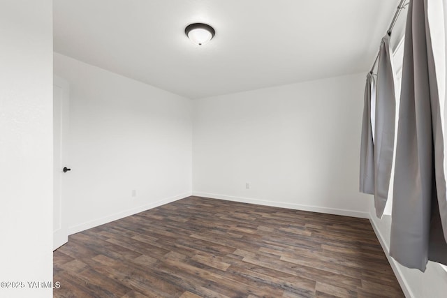 12307 Tieton Dr, Yakima, WA 98908 - unfurnished bedroom featuring dark wood-style floors and baseboards