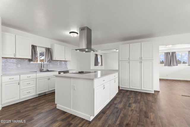 12307 Tieton Dr, Yakima, WA 98908 - kitchen with island range hood, black electric stovetop, a center island, a sink, and light countertops