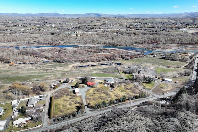 drone / aerial view featuring a mountain view