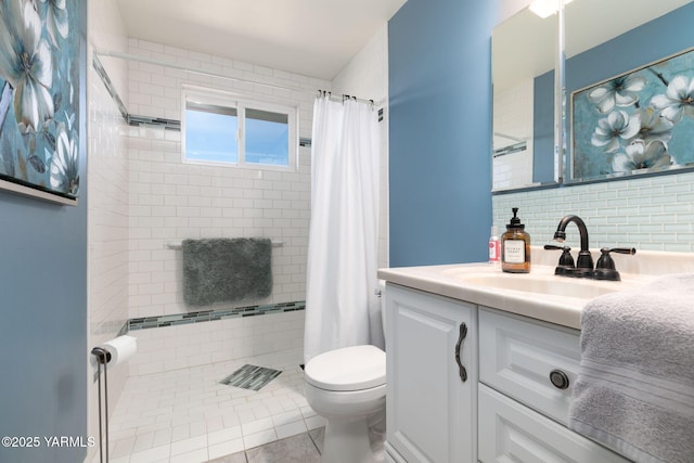 full bath with decorative backsplash, tiled shower, toilet, tile patterned flooring, and vanity