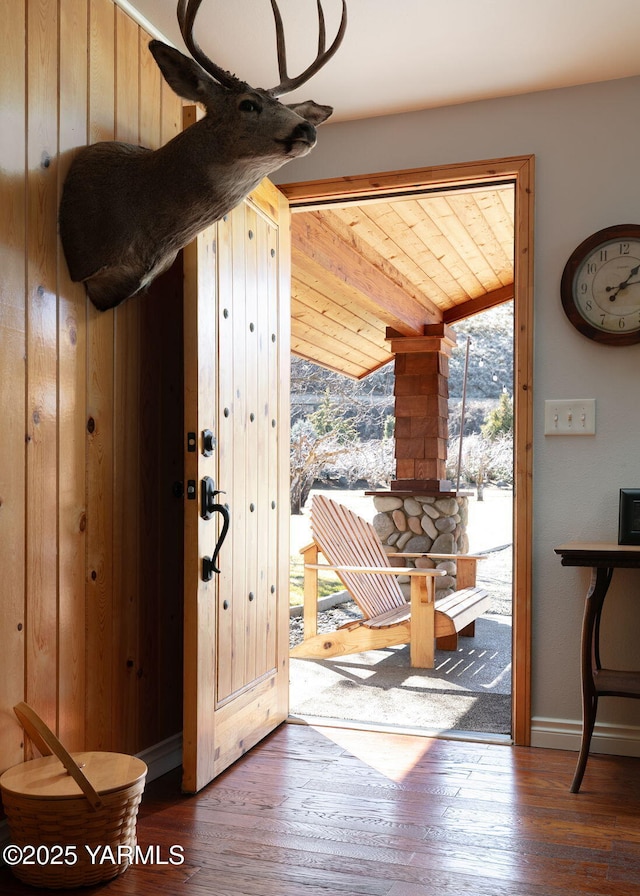 entryway with hardwood / wood-style flooring and baseboards