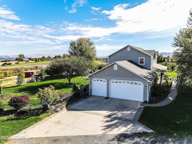 11901 Zier Rd, Yakima, WA 98908 - view of front of home with an attached garage, driveway, and a mountain view