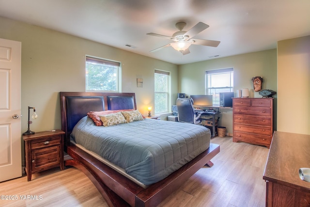 11901 Zier Rd, Yakima, WA 98908 - bedroom featuring multiple windows, light wood-style floors, and ceiling fan