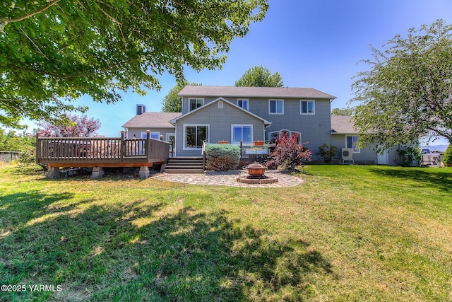 11901 Zier Rd, Yakima, WA 98908 - rear view of house featuring a fire pit, a wooden deck, and a yard
