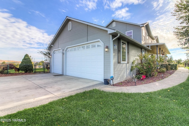 11901 Zier Rd, Yakima, WA 98908 - view of side of home with a garage and driveway