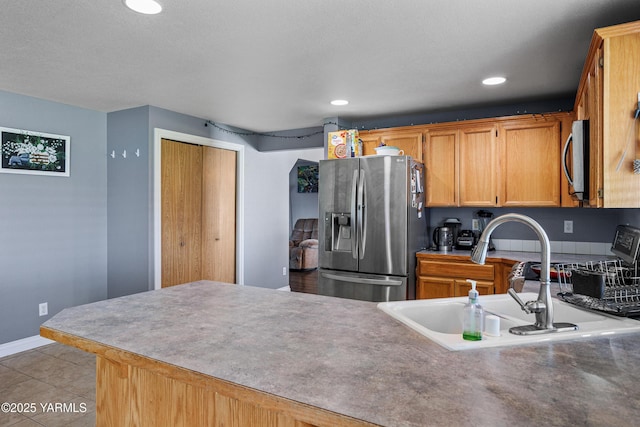 506 Millenium Ave, Moxee, WA 98936 - kitchen featuring stainless steel appliances, a peninsula, light tile patterned flooring, and recessed lighting