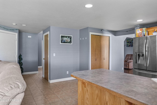 506 Millenium Ave, Moxee, WA 98936 - kitchen with stainless steel fridge with ice dispenser, light tile patterned floors, and recessed lighting
