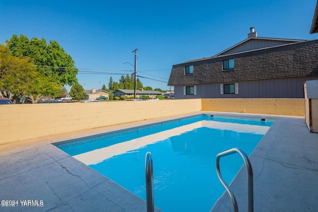 view of pool with a patio, a fenced backyard, and a fenced in pool