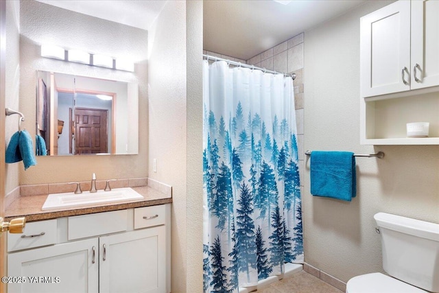 10401 N 1739th Pr NW, Grandview, WA 98930 - bathroom with toilet, vanity, and a shower with shower curtain