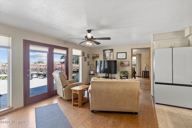 10401 N 1739th Pr NW, Grandview, WA 98930 - living area with a ceiling fan, french doors, and light wood finished floors