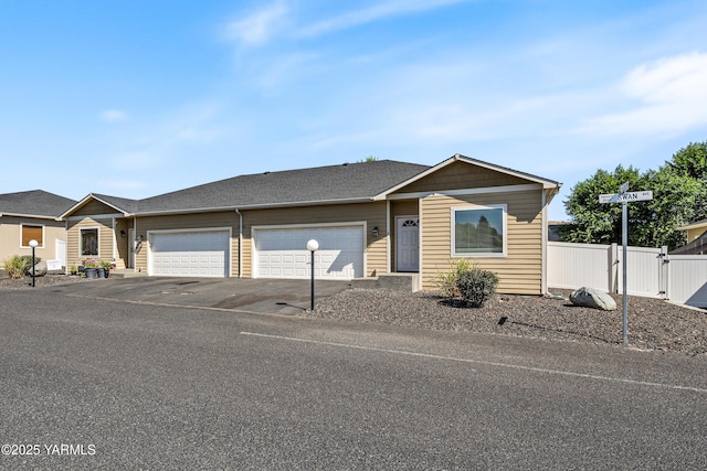3101 Swan Ave, Yakima, WA 98902 - ranch-style home featuring an attached garage, driveway, and a gate